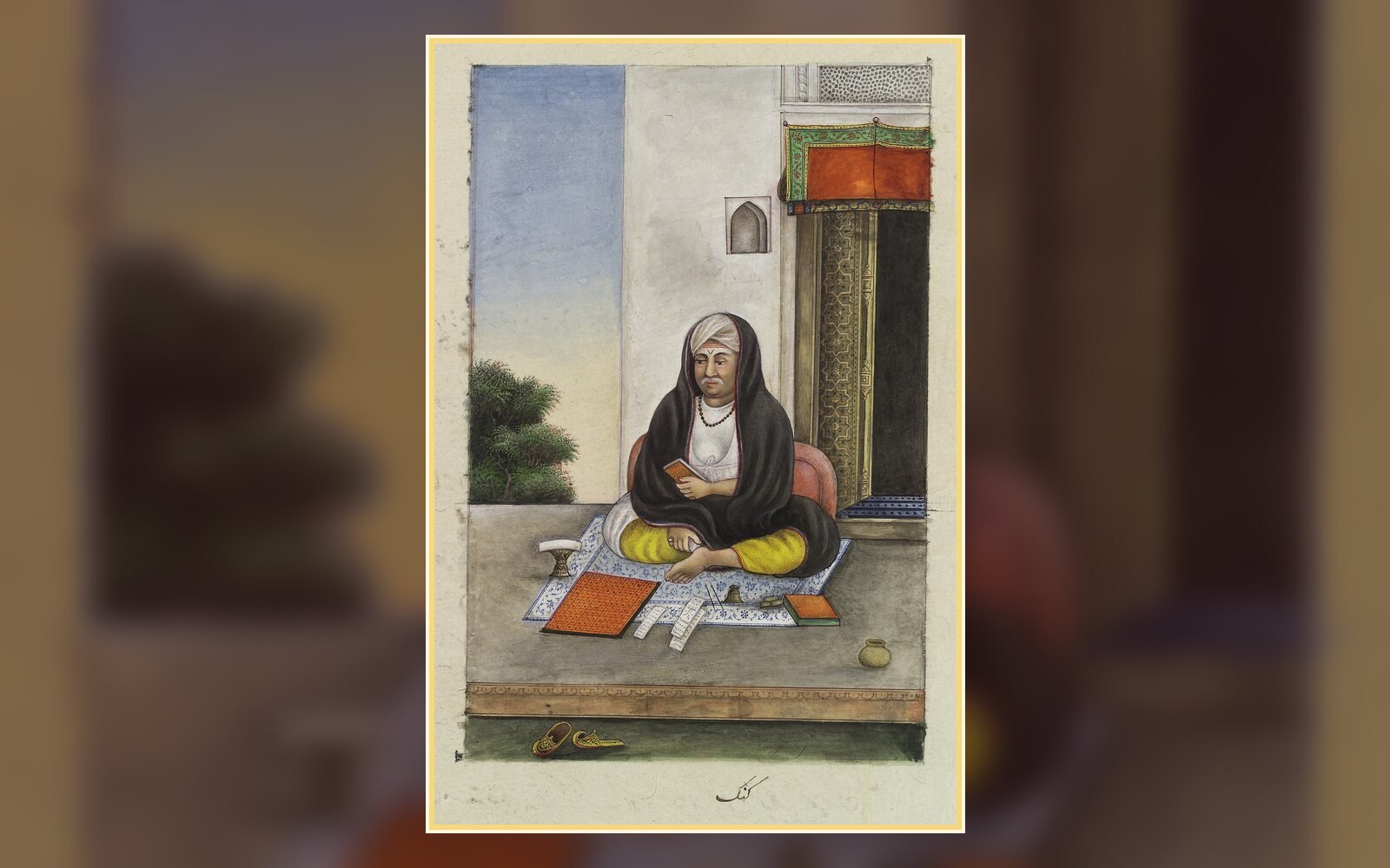 Early 19th-century painting of an Indian astrologer seated with his almanacs