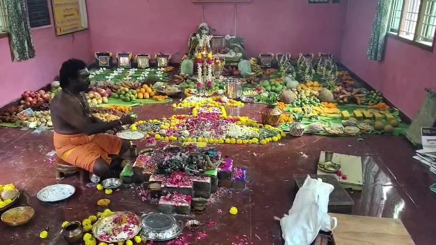 A homam in progress, offerings arranged around the sacred fire